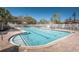 Community pool with crystal clear water, poolside furniture, and well-maintained brick deck at 3515 Albritton St, New Port Richey, FL 34655
