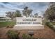 Longleaf Elementary School sign surrounded by greenery and trees, marking the entrance to the educational institution at 3515 Albritton St, New Port Richey, FL 34655
