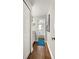 Hall bathroom with granite vanity and a view of the tub/shower combo at 4140 Passport Ln # 204, New Port Richey, FL 34653