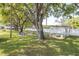 Outdoor common area with grass and picnic tables at 4140 Passport Ln # 204, New Port Richey, FL 34653