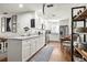 Bright kitchen features white cabinets, stainless steel appliances, and beautiful countertops at 4140 Passport Ln # 204, New Port Richey, FL 34653