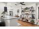 Open kitchen with island, stainless appliances, decor shelving and adjacent breakfast nook at 4140 Passport Ln # 204, New Port Richey, FL 34653