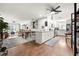 Open-concept living space with hardwood floors, a kitchen island, and a spacious layout at 4140 Passport Ln # 204, New Port Richey, FL 34653