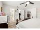 Bright main bedroom with a ceiling fan, modern decor and ensuite bathroom and walk-in closet at 4140 Passport Ln # 204, New Port Richey, FL 34653