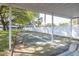 Outdoor shuffleboard common area with a white fence at 4140 Passport Ln # 204, New Port Richey, FL 34653