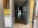 View of a hallway with a side kitchen counter leading to sliding glass doors at 4223 Sheldon Pl # H, New Port Richey, FL 34652