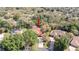 An aerial view showcasing the home's lot, surrounding trees, and a private pool area at 4475 Rachel Blvd, Spring Hill, FL 34607