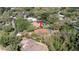 Aerial shot of a beautiful property featuring a pool, surrounded by mature trees, offering a private retreat at 4475 Rachel Blvd, Spring Hill, FL 34607