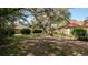 Lawn features mature landscaping around the home's exterior at 4475 Rachel Blvd, Spring Hill, FL 34607