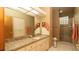 Bathroom featuring a granite countertop vanity, tile floors and a walk in shower at 4475 Rachel Blvd, Spring Hill, FL 34607