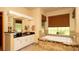 Well-lit bathroom featuring a jetted tub, tiled floors, and vanity with lots of storage at 4475 Rachel Blvd, Spring Hill, FL 34607