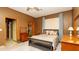 Spacious bedroom featuring tile floors, natural light, and neutral decor for a comfortable retreat at 4475 Rachel Blvd, Spring Hill, FL 34607