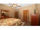 Bedroom featuring a ceiling fan, and comfortable bed at 4475 Rachel Blvd, Spring Hill, FL 34607