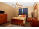 Bedroom featuring a ceiling fan, and comfortable bed at 4475 Rachel Blvd, Spring Hill, FL 34607