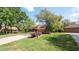 Lawn and landscape including mature trees accentuates the home's exterior at 4475 Rachel Blvd, Spring Hill, FL 34607