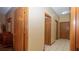 Hallway with tile floors and wooden trim doors at 4475 Rachel Blvd, Spring Hill, FL 34607