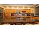 Spacious kitchen with granite counters, wood cabinets and seating for two at the island at 4475 Rachel Blvd, Spring Hill, FL 34607