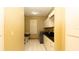 Functional laundry room featuring white cabinets, countertops, and modern washer and dryer at 4475 Rachel Blvd, Spring Hill, FL 34607