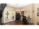 Bright and functional home office with modern desk, tile flooring, and natural lighting at 4475 Rachel Blvd, Spring Hill, FL 34607