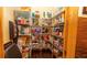 Walk-in pantry with metal shelving stocked with various food items and supplies, providing ample storage at 4475 Rachel Blvd, Spring Hill, FL 34607
