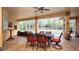 Inviting covered patio with decorative dining table and chairs overlooking the screened-in pool area at 4475 Rachel Blvd, Spring Hill, FL 34607