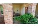 Front porch with a bench seat and decorative brick pillars at 4475 Rachel Blvd, Spring Hill, FL 34607