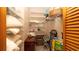 A well-organized walk-in closet with shelving and ample storage for personal belongings at 4475 Rachel Blvd, Spring Hill, FL 34607