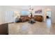 Inviting living room with tile flooring, a ceiling fan, and comfortable leather seating at 4608 Elwood Rd, Spring Hill, FL 34609