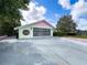 Charming single Gathering home with a spacious driveway and unique architectural details at 4608 Mariner Blvd, Spring Hill, FL 34609