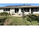 The backyard offers a nice patio and chairs with a well maintained yard at 4748 Yellowstone Dr, New Port Richey, FL 34655
