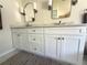 Close-up of the bathroom vanity with white cabinetry, marble countertop, and modern hardware at 4748 Yellowstone Dr, New Port Richey, FL 34655