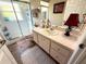 Cozy bathroom featuring a vanity with a mirror, a shower, and a peach colored tiled floor at 4748 Yellowstone Dr, New Port Richey, FL 34655
