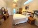 Spacious bedroom with a vaulted ceiling, light-colored walls, and a mix of wood furniture at 4748 Yellowstone Dr, New Port Richey, FL 34655