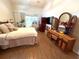 Bedroom featuring bed, dark wood furniture, and sliding glass doors to lanai at 4748 Yellowstone Dr, New Port Richey, FL 34655