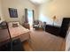 Cozy spare bedroom featuring bed, curtains, and sitting area at 4748 Yellowstone Dr, New Port Richey, FL 34655