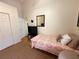 Spare bedroom with a day bed and a view through to the entry hall at 4748 Yellowstone Dr, New Port Richey, FL 34655