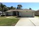 Charming single-story home featuring a two-car garage, well-maintained lawn, and lovely landscaping at 4748 Yellowstone Dr, New Port Richey, FL 34655