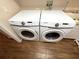 Close up view of a Samsung washer and dryer with wood floors in the laundry room at 4748 Yellowstone Dr, New Port Richey, FL 34655