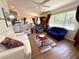 Open living room with lots of natural light and a view through the dining and kitchen area at 4748 Yellowstone Dr, New Port Richey, FL 34655