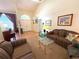 Inviting living room with high ceilings and neutral tones, furnished with couches and a glass coffee table at 4748 Yellowstone Dr, New Port Richey, FL 34655
