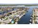 Aerial view of a waterfront neighborhood with beautiful homes, private boat docks, and scenic waterways at 5033 Cabrilla Ct, New Port Richey, FL 34652
