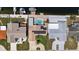 Aerial shot of waterfront home with a private pool, dock, and solar panels at 5033 Cabrilla Ct, New Port Richey, FL 34652