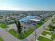 Aerial view of a building in a waterfront community, featuring ample parking and landscaping at 5033 Cabrilla Ct, New Port Richey, FL 34652