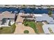 Waterfront property with boat dock access, solar panels, paver driveway, and lush landscaping at 5033 Cabrilla Ct, New Port Richey, FL 34652