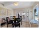 The dining nook features a glass door to the outside and lots of natural light at 5033 Cabrilla Ct, New Port Richey, FL 34652