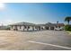 Well maintained commercial building with ample parking, lush landscaping, and covered entrances at 5033 Cabrilla Ct, New Port Richey, FL 34652