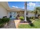 Beautiful home entrance showcasing a well-maintained lawn and stone accents at 5033 Cabrilla Ct, New Port Richey, FL 34652