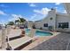 Inviting backyard pool with lounge chairs, lush landscaping, and a serene waterfront setting at 5033 Cabrilla Ct, New Port Richey, FL 34652