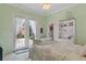 Bright bedroom with French doors to courtyard and white shelving at 5110 Championship Cup Ln, Spring Hill, FL 34609