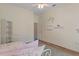 This bedroom includes decorative shelves, ceiling fan and a built in closet at 5110 Championship Cup Ln, Spring Hill, FL 34609